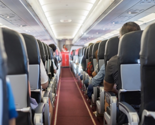 passenger seat, Interior of airplane with passengers sitting on